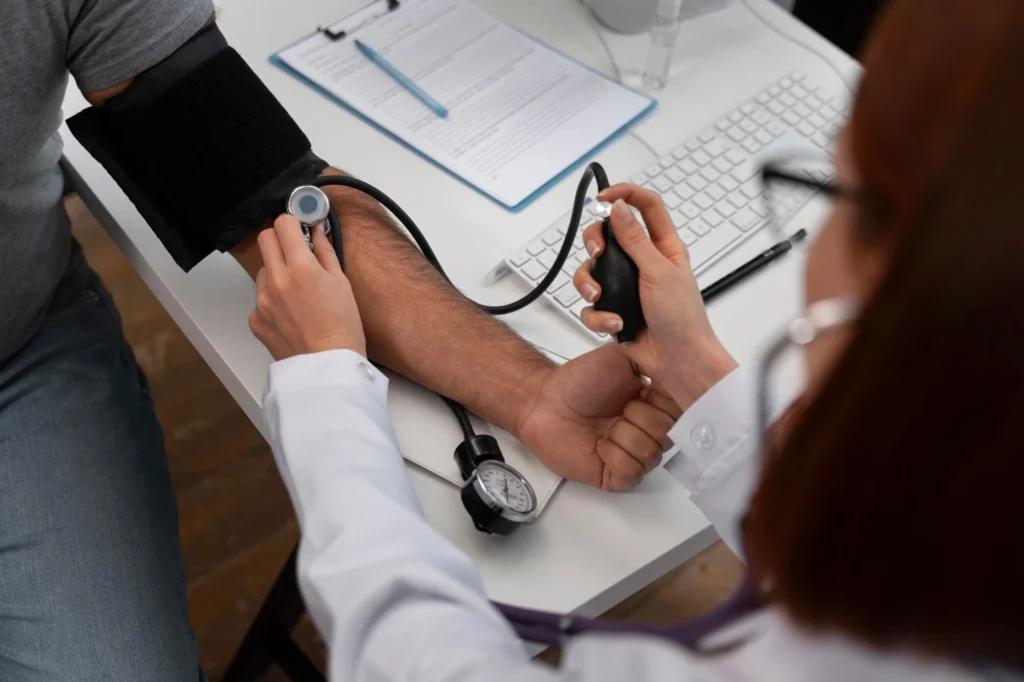 Doctor checking a patient's heart